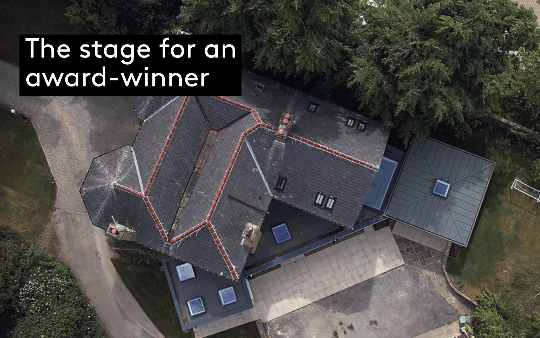 Aerial view of Pembroke House, an extended Victorian home in Roundhay, Leeds, showing the garden pavilion glass roof and the new outbuilding