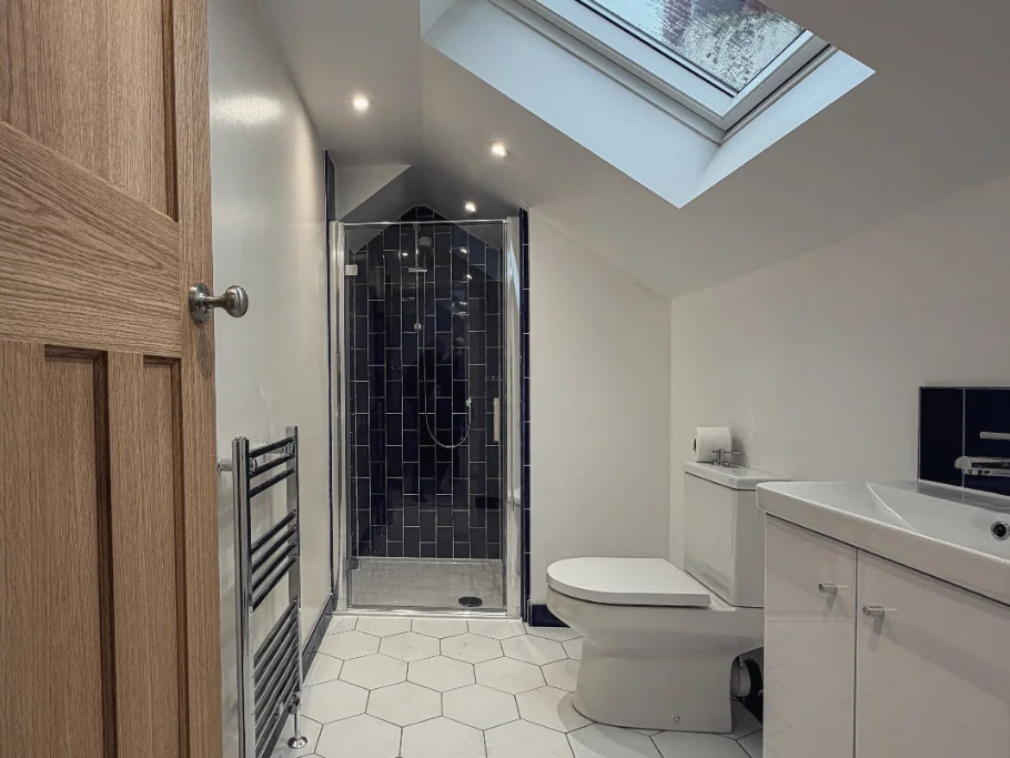 Completed dormer loft conversion clad in warm red clay hanging tiles, Roundhay, Leeds