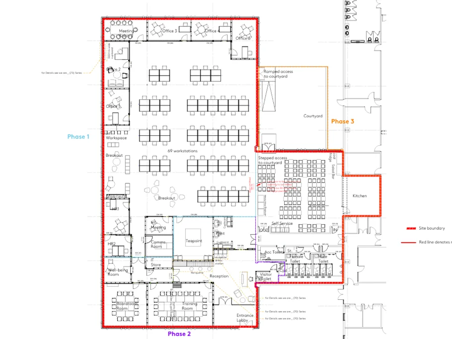 Reworked reception and layout of a Howdens interior fit-out, with timber panelling and signature red joinery