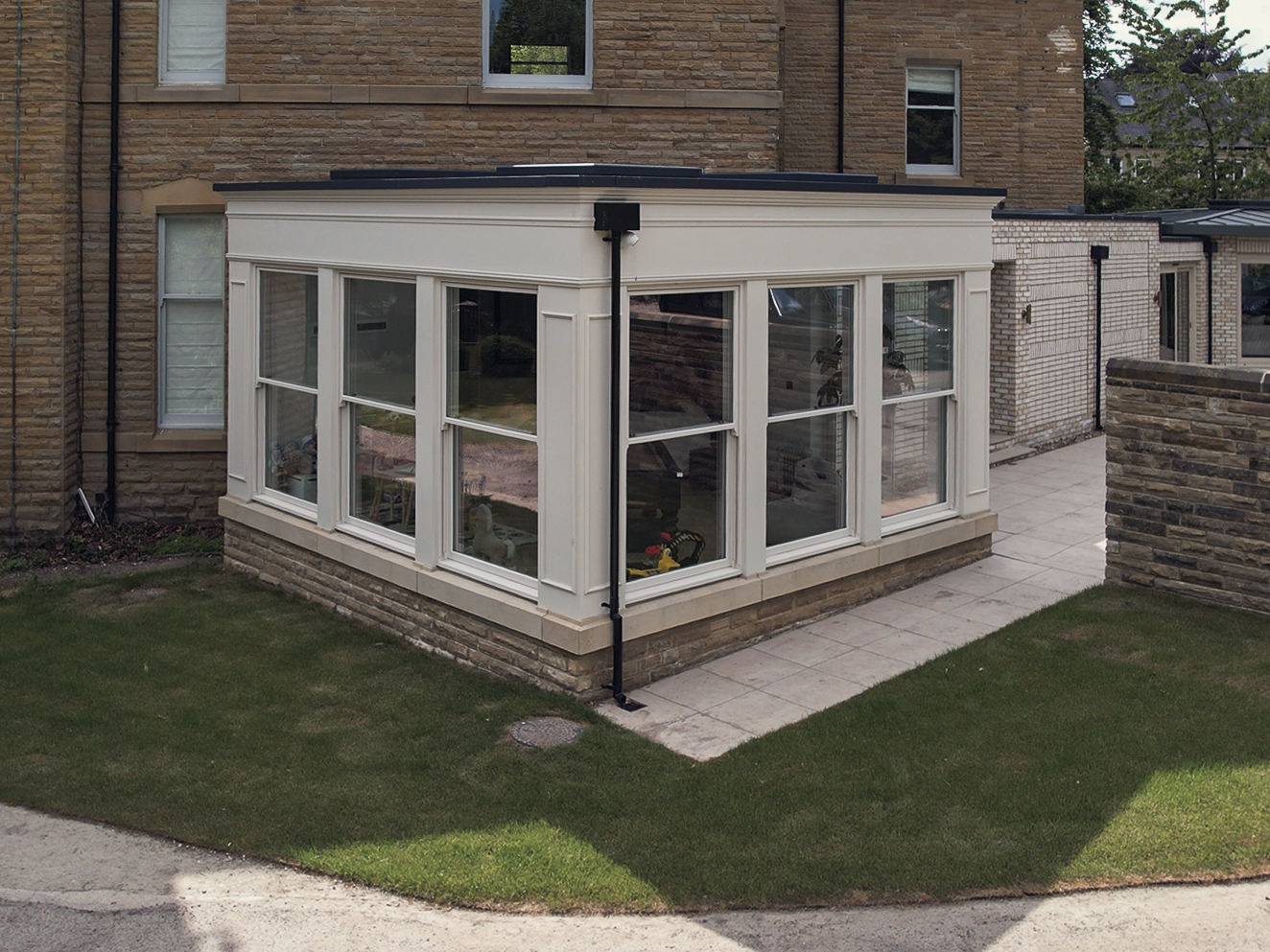 Traditional orangery alongside the Victorian frontage, seen from the road in Roundhay, Leeds