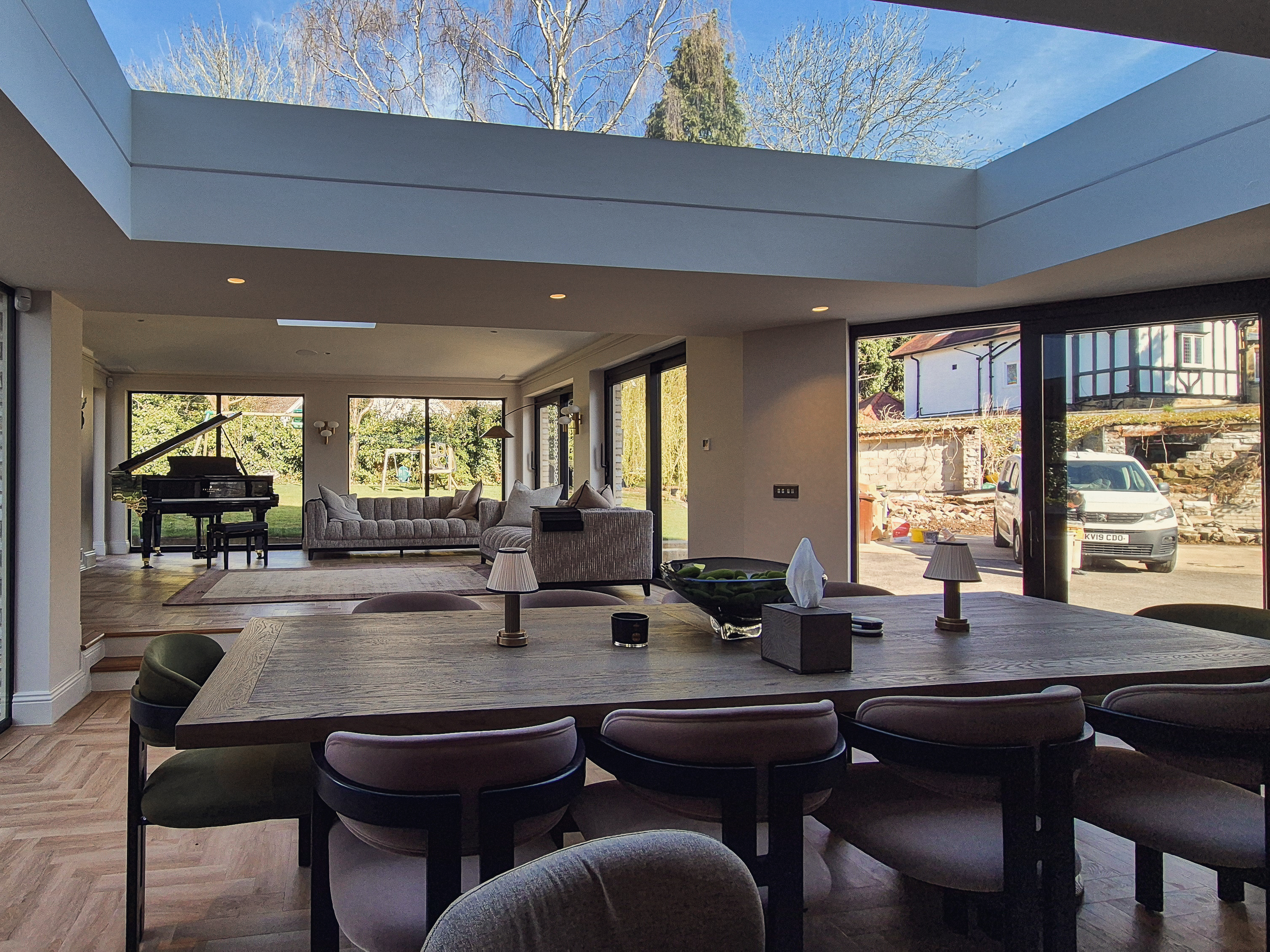 Daylight from a large central rooflight falling across the masonry and finishes of the pavilion interior, Roundhay, Leeds